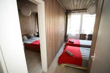 Фото номера Четырехместный номер с балконом Гостевой дом Hostel El Nido г. Нида 6