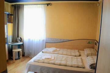 Фото номера Двухместный номер с 1 кроватью, вид на сад Гостевой дом K8-5 Apartments г. Нида 7