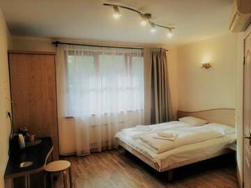 Фото номера Двухместный номер с 1 кроватью, вид на сад Гостевой дом K8-5 Apartments г. Нида 12