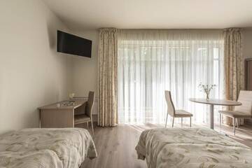 Фото номера Апартаменты с 2 односпальными кроватями Отель ORO Nida г. Нида 2