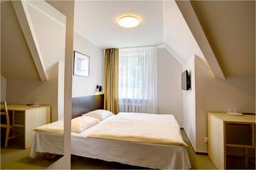 Фото номера Двухместный номер с 2 отдельными кроватями Отель Hotel Jurate г. Нида 6